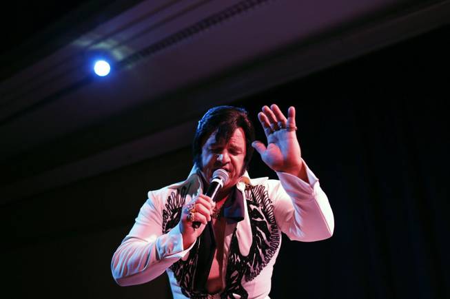 In this July 12, 2014 photo, Tony Freitas, of Oakdale, Calif., performs during the Las Vegas Elvis Festival in Las Vegas. Some three dozen Elvis tribute artists took their gyrating hips and curled lips to the stage over the weekend to see who could do the most convincing portrayal.