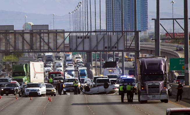 Northbound lanes of Interstate 15 are closed after a multi-car accident near Charleston Boulevard during rush hour Wednesday, July 16, 2014. 
