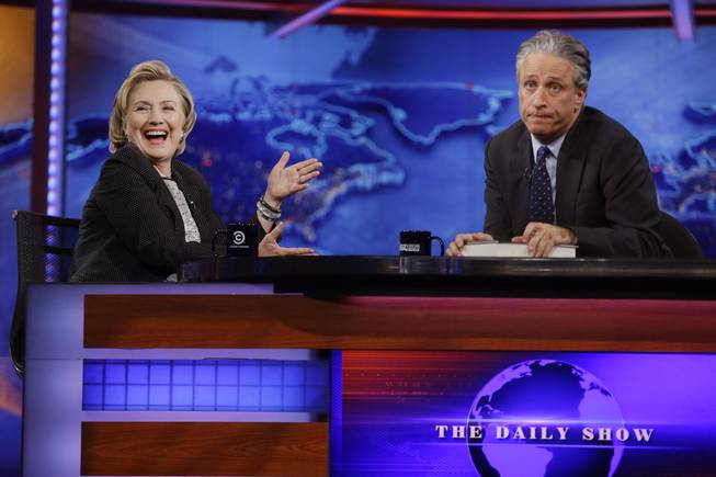 Former U.S. Secretary of State Hillary Rodham Clinton reacts to host Jon Stewart during a taping of "The Daily Show with Jon Stewart," Tuesday, July 15, 2014, in New York.