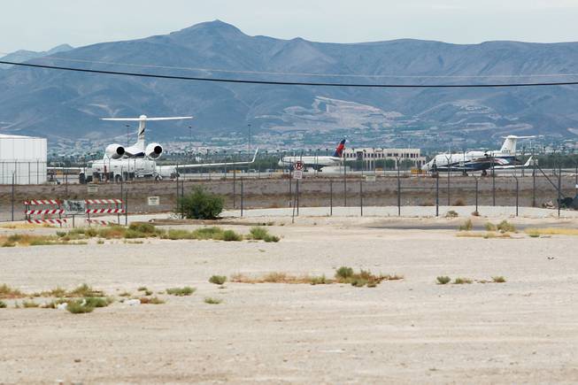 Jets at McCarran International Airport are seen across a vacant lot on the south end of the Strip Tuesday, July 15, 2014.