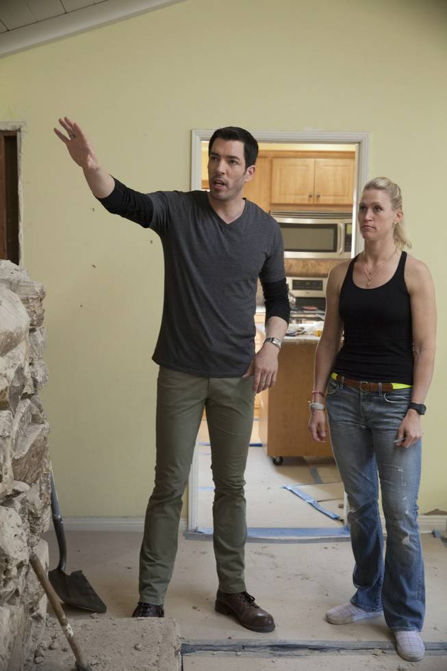 Interior designer Melissa Roche of Las Vegas competes in Season 2 of “Brother vs. Brother” on HGTV. Drew Scott checks in with Roche in the larger living room of the Hodge house in Northridge, Calif. Roche, part of Team Drew, was crowned the champion on the finale Sunday, July 13, 2014.
