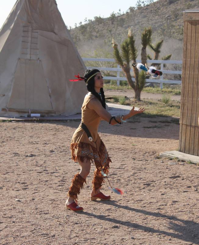 Add hatchet artistry to the list of skills for Penny Pibbets, shown during the video shoot for Melody Sweets' "Shoot 'em Up" at Grand Canyon Ranch on April 22, 2014.