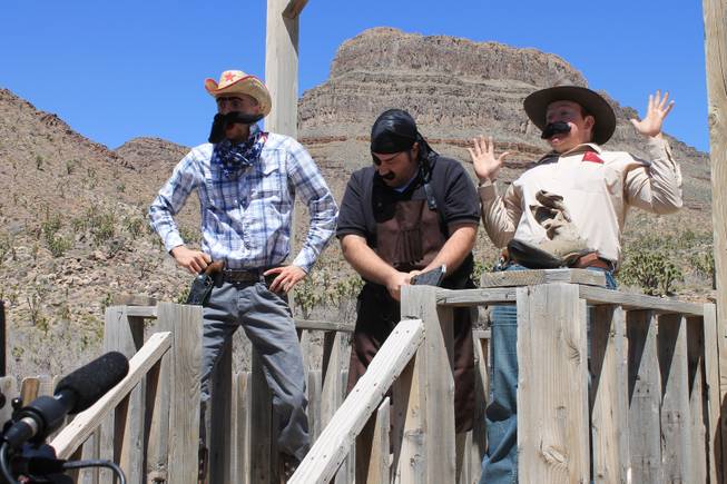 Members of "Absinthe," from left, Misha Furmanczyk, Daniel Kells (the show's company manager) and Paul Lopez (who portrays high-wire artist Fat Frank) during the video shoot for Melody Sweets' "Shoot 'em Up" at Grand Canyon Ranch on April 22, 2014.