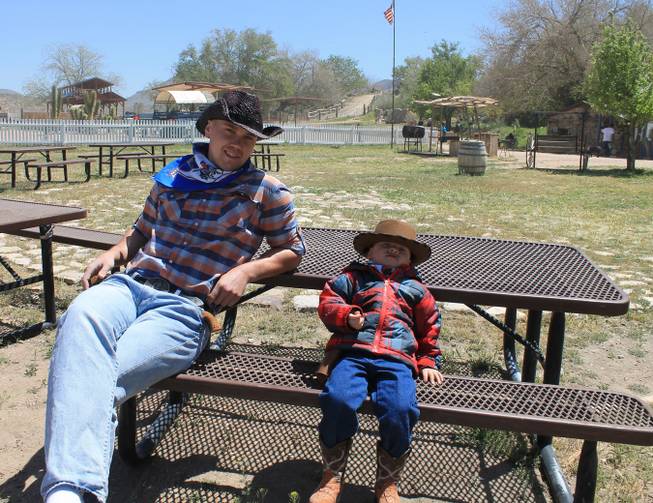 Sergie Matvienko and his son, Yuryi, during the video shoot for Melody Sweets' "Shoot 'em Up" at Grand Canyon Ranch on April 22, 2014.
