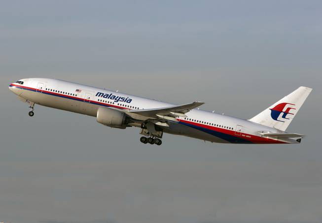 In this Nov. 15, 2012 photo, a Malaysia Airlines Boeing 777-200 takes off from Los Angeles International Airport in Los Angeles. The plane, with the tail number 9M-MRD, is the same aircraft that was heading from Amsterdam to Kuala Lumpur on Thursday, July 17, 2014 when it was shot down near the Ukraine Russia border.