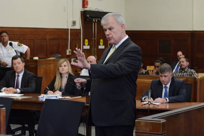 William Kennedy, attorney for the famlies of Safiro Furtado and Daniel de Abreu, gestures as he makes a point during arguments Wednesday, July 2, 2014, in Boston. Seated left to right are New England Patriot attorneys Andrew Phelan and Emily Renshaw, and Aaron Hernandez's attorney John Fitzpatrick. Tje Patriots don't owe "another penny" to former tight end Hernandez, who is charged in three killings, a team lawyer told the judge Wednesday. Hernandez was not present.