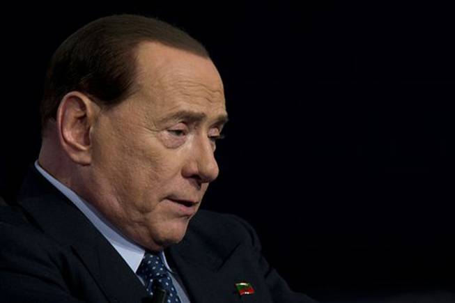 Former Italian Premier Silvio Berlusconi, shown in this May 2014 file photo, was acquitted by an Italian appeals court in a case where he was alleged to have paid for sex with underage Moroccan prostitute Karima el-Mahroug, better known as Ruby, and then used his influence to cover it up. The acquittal was announced Friday, July 18, 2014.