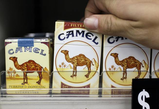 In this Feb. 1, 2011, photo, Camel cigarettes, an R.J. Reynolds product, are on display at a liquor store.