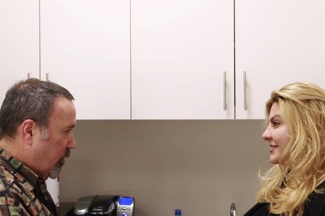Michelle Fiore talks with radio personality Alan Stock before appearing on his radio show May 8, 2014.
