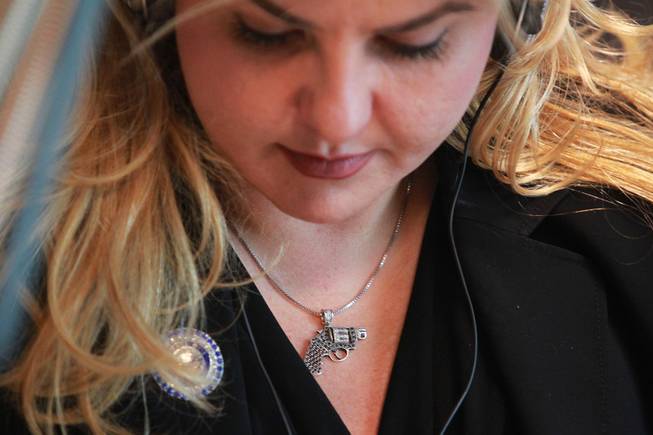 Michelle Fiore wears a handgun pendant while taking part in Alan Stock's radio program May 8, 2014.