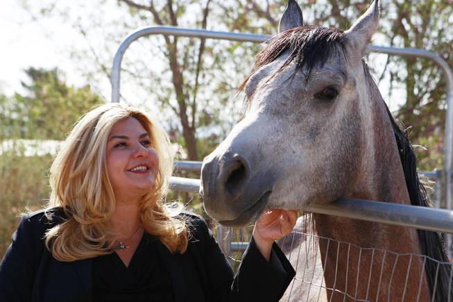 Michelle Fiore visits her horse Remington May 8, 2014.