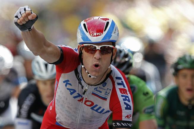 Norway's Alexander Kristoff crosses the finish line to win the fifteenth stage of the Tour de France cycling race over 222 kilometers (137.9 miles) with start in Tallard and finish in Nimes, France, Sunday, July 20, 2014.