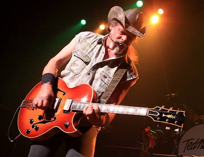 This Aug. 16, 2013, file photo shows Ted Nugent performing at Rams Head Live in Baltimore. 