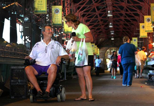 Dave Larson, who suffers from amyotrophic lateral sclerosis, and his wife, Ann, shop in St. Louis. Larson got his ALS diagnosis in January 2013 after dealing with slurred speech and having issues swallowing.