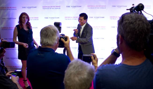 Performer Clint Holmes plays up for the cameras on the red carpet as The Venetian Las Vegas announces the engagement of "Georgia On My Mind: The Music of Ray Charles" on Tuesday, July 22, 2014.
