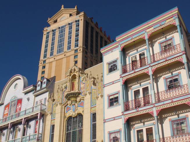 This Dec. 27, 2013, photo shows the exterior of Caesars Atlantic City in Atlantic City N.J., with the Wild West facades of Bally's Atlantic City in the foreground. 