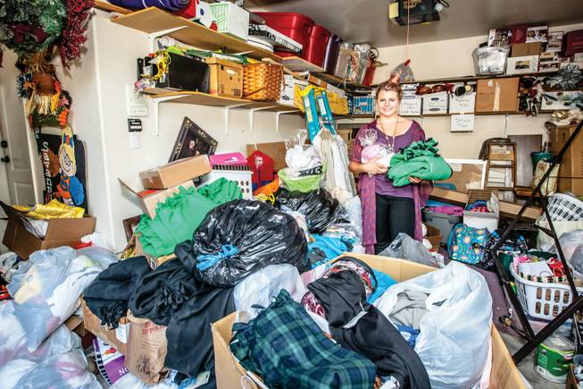 Dedicated to helping at-risk teens, co-founder 14-year-old Siena Prenger stands in a packed garage of clothing, school supplies, homemade blankets and hygiene kits collected as part of her nonprofit “Teens Helping Teens” at her home in North Las Vegas. 