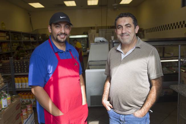 Business partners Ghazwan "Gino" Salem, left, of Iraq, and Abdul Nasser Karouni of Lebanon pose at the Afandi Restaurant and Market, 5181 W. Charleston Blvd., Tuesday, July 15, 2014. STEVE MARCUS
