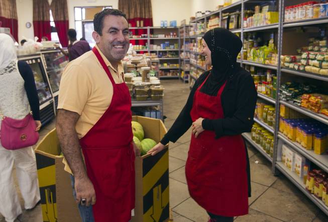 Abdul Nasser Karouni is shown with his wife Marian at the Afandi Restaurant and Market, 5181 W. Charleston Blvd., Tuesday, July 15, 2014. His wife was granted citizenship over a year ago but Abdul is still waiting. 