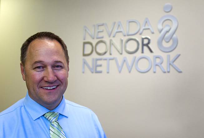 Brent Bergquist, director of ocular services at the Nevada Donor Network, poses at the Network offices Tuesday, July 22, 2014.