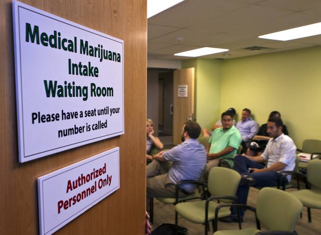 Applicants gather to be processed on the last day to submit applications to the Las Vegas Department of Planning for medical marijuana dispensaries, cultivation or production on Wednesday, July 23, 2014.