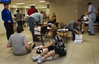 Applicants gather to be processed as today is the last day to submit applications to the Las Vegas Department of Planning for medical marijuana dispensaries, cultivation or production on Wednesday, July 23, 2014.