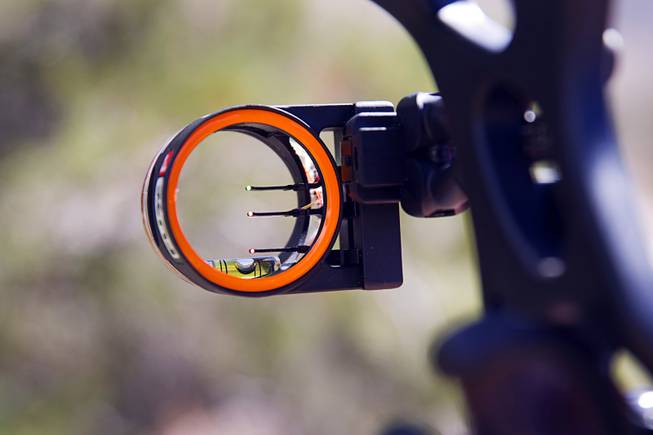 A bow sight is shown on a compound bow at the Las Vegas Archers Spring Mountain Range near Mountain Springs Sunday, July 20, 2014.