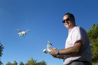 Earl Brown flies his DJI Phantom 2 Vision quadcopter drone at The Hills Park in Summerlin Thursday, July 24, 2014.  Brown turned to Craigslist after losing the drone on a flight earlier in the month.