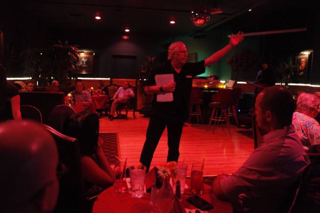 Lee Mallory recites poetry at Ichabod’s in Las Vegas. “I want people to understand that poetry can be a touchstone in their lives, for their understanding of the world and their own growth,” Mallory said.