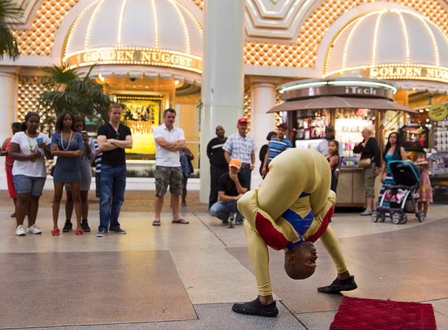 Contortionist Kelvin Gordon performs at Fremont Street Experience on Sunday, July 27, 2014, in downtown Las Vegas.