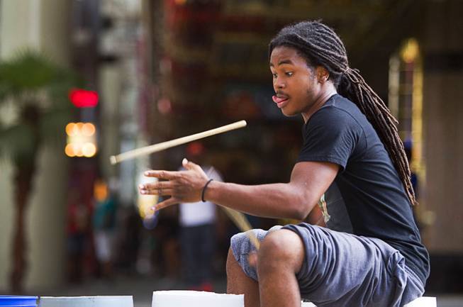 Drummer JaRed Crawford, 17, a Las Vegas Academy senior, performs at the Fremont Street Experience Sunday, July 27, 2014.