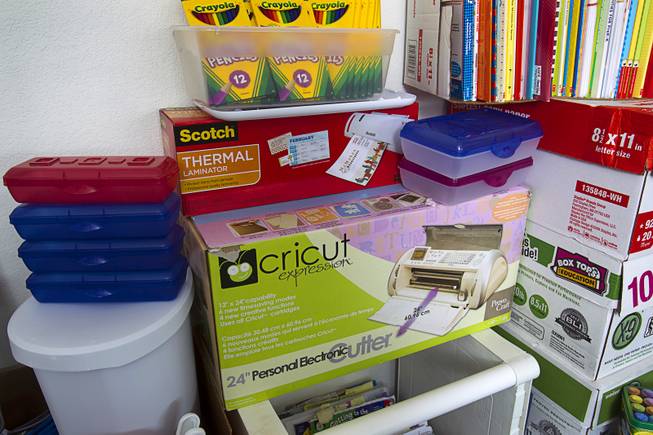 School supplies purchased by kindergarten teacher Christine Cordova are stacked against a wall in the garage of her home in Henderson Sunday, July 27, 2014. Cordova rented a 19-foot U-Haul to pack up her classroom supplies from her old school as she prepares to move into a new school in the fall.