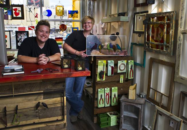 Owners Mya Daily and Ellisha Haddix of stained glass business Lead In the Window within their Container Park shop on Friday, July 25, 2014.