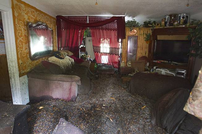 Flood damage is shown in a home in the Rainbow Subdivision on Mt. Charleston Monday, July 28, 2014. The neighborhood was hit hard by flooding and debris in runoff last year as well.