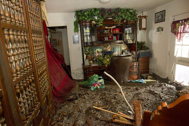 Flood damage is shown in a home in the Rainbow Subdivision on Mt. Charleston Monday, July 28, 2014. The neighborhood was hit hard by flooding and debris in runoff last year as well.