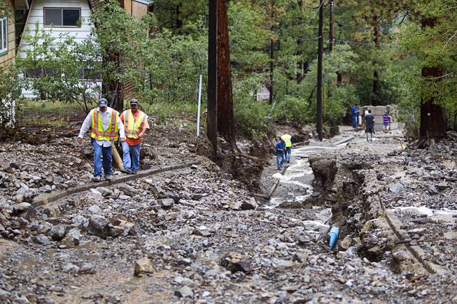 A view of damage to Rainbow Canyon Boulevard in the Rainbow Subdivision on Mt. Charleston Monday, July 28, 2014. The neighborhood was hit hard by flooding and debris in runoff last year as well.