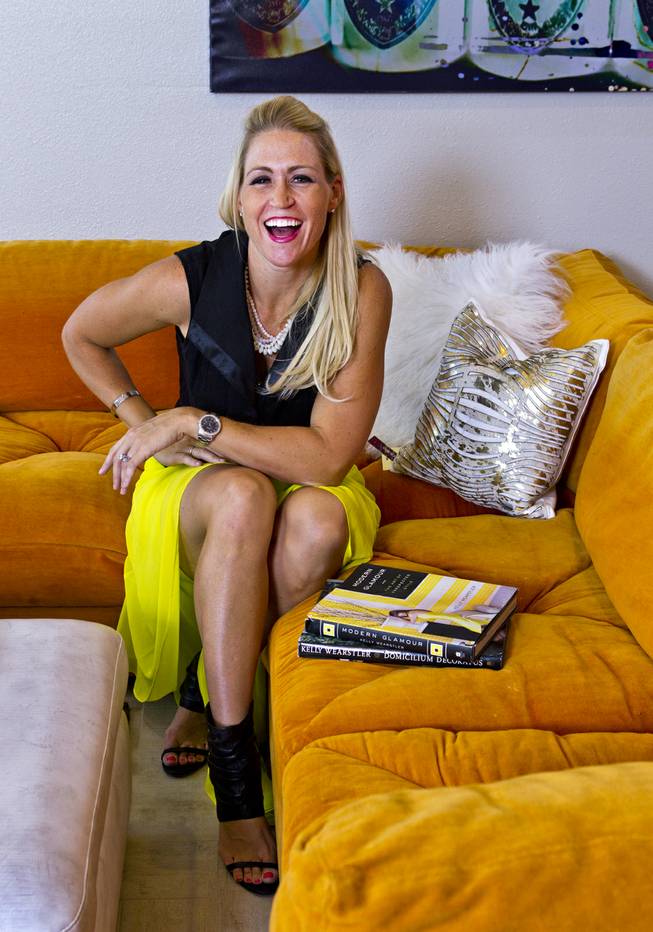 Melissa Roche laughs on her couch in Parlor 430 on Monday, July 28, 2014. She is a local interior designer and Season 2 winner on HGTVs "Brother vs. Brother."