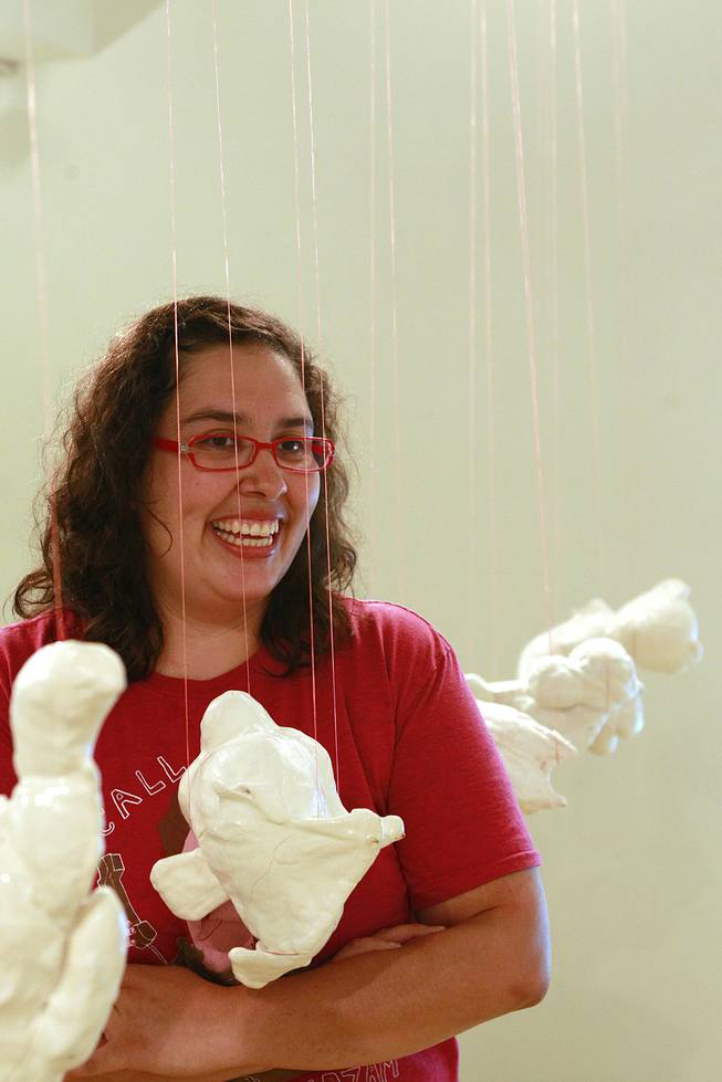 Yasmnia Chavez at her exhibit "Floss and Gravity" at TastySpace Saturday, July 26, 2014.