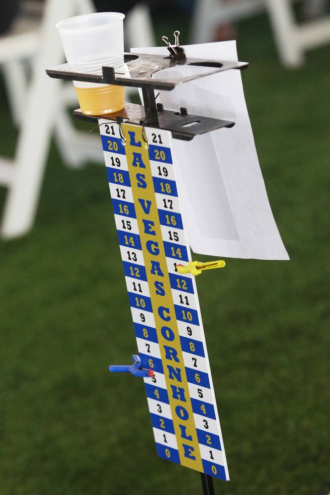 A scoreboard with a cupholder is seen during a Cornhole tournament Saturday, July 26, 2014.