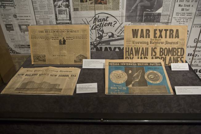 Various Nevada newspapers are on display at the "Every Age is an Information Age" exhibit at the Nevada State Museum, Friday July 25, 2014. The exhibit shows 150 years of communication technology in Nevada.