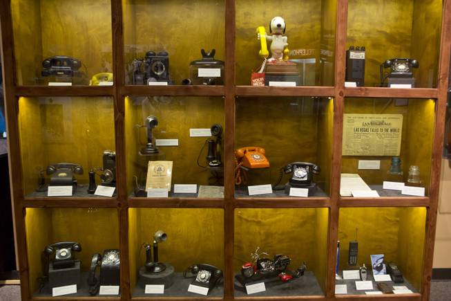 A visual timeline of telephones are on display at the "Every Age is an Information Age" exhibit at the Nevada State Museum, Friday July 25, 2014. The exhibit shows 150 years of communication technology in Nevada.