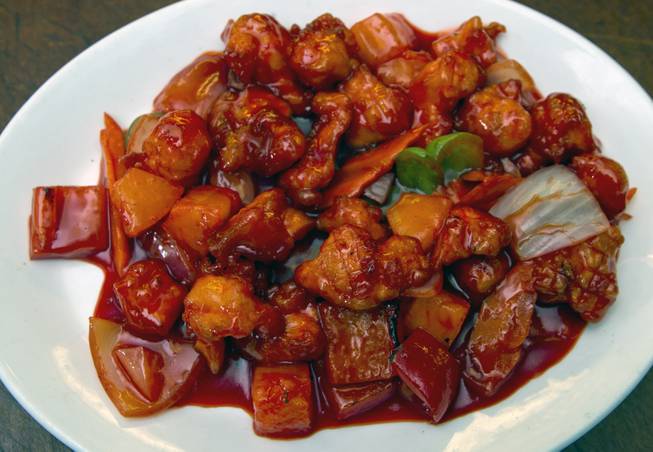 Sweet and Sour Chicken dish by Chef Ivo Karkaliev now cooking Chinese food for the Cafe Fiesta at Fiesta Henderson on Monday, July 28, 2014.