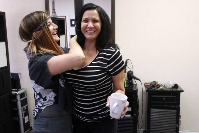 Cupcake Girls founder Joy Hoover laughs with Christine after giving her a dye job July 23, 2014.