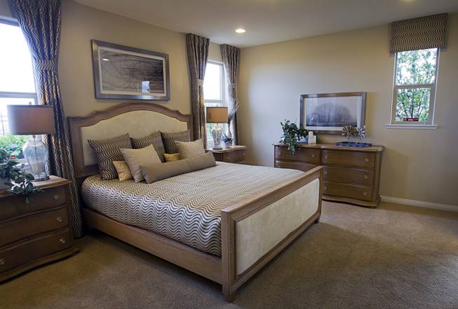 The master bedroom is shown in a one-story plan 1849 model home at KB Homes' Tevare residential development in Summerlin Wednesday, July 30, 2014.