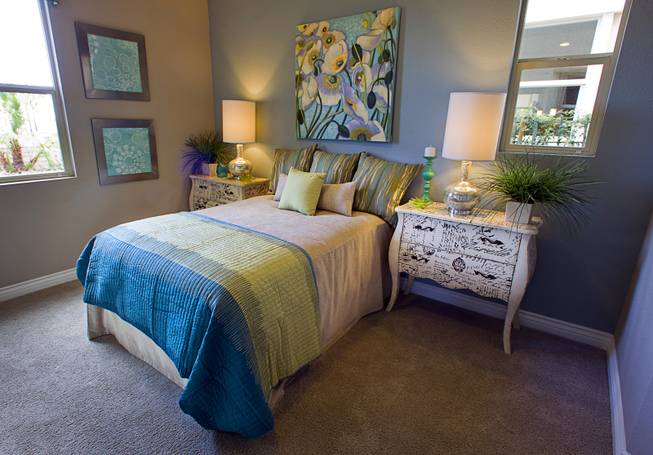A downstairs guest bedroom is shown in a two-story plan 2568 model home at KB Homes' Tevare residential development in Summerlin Wednesday, July 30, 2014.