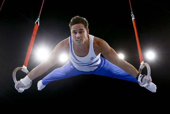 Silver medalist Daniel Keatings of Scotland performs on the rings during the Men's All-Around gymnastics competition at the Scottish Exhibition Conference Centre during the Commonwealth Games 2014 in Glasgow, Scotland, Wednesday July 30, 2014. 