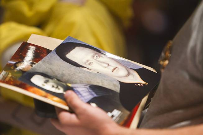 A fan holds a photo of Lt. Commander Data of Star Trek: The Next Generation as he waits in line for autographs during the 13th annual Official Star Trek Convention at the Rio Thursday, July 31, 2014. The convention, expected to attract 15,000 Trekkies, runs through Sunday.