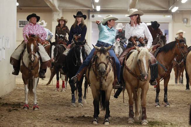 Cowgirls wait to compete during the Cowboy Mounted Shooting Association's Western U.S. ChampionshipThursday, July 31, 2014 at the South Point.