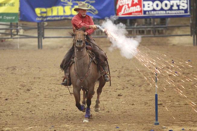 Dwight Barhite competes during the Cowboy Mounted Shooting Association's Western U.S. ChampionshipThursday, July 31, 2014 at the South Point.