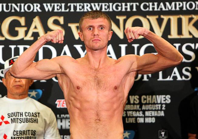 Undefeated Anton Novikov of Chelyabinsk, Russia flexes on the scale during an official weigh-in at the Cosmopolitan Friday, August 1, 2014. Novikov will challenge the undefeated WBA Jr. Welterweight champion Jessie Vargas of Las Vegas in the Chelsea at the Cosmopolitan Saturday.